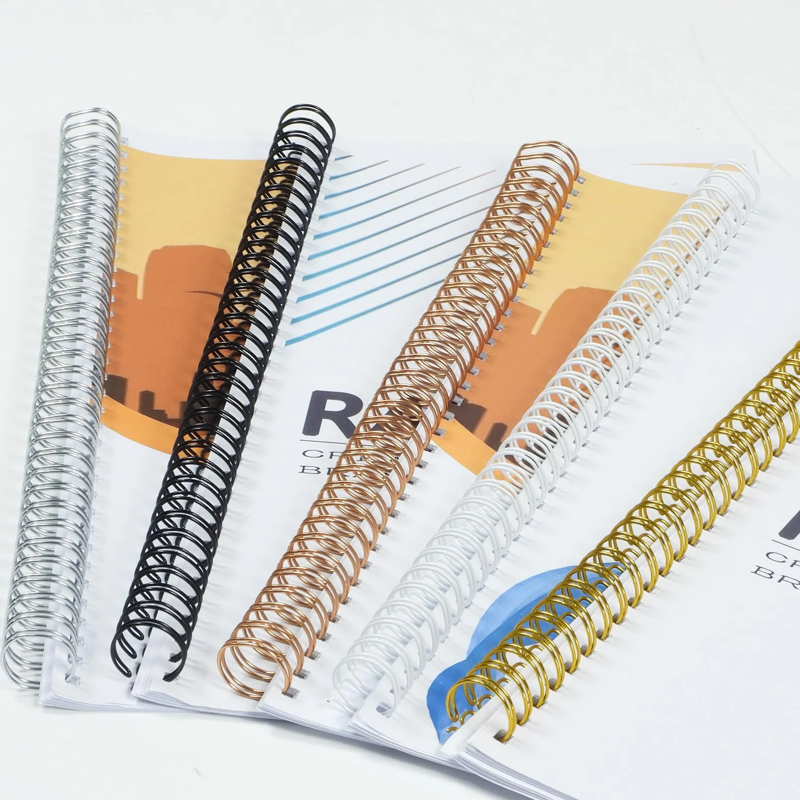 RAYSON Kolce druciane, 105 arkuszy, podział 3:1, 15,9 mm, 34 pętle A4, kolorowe, 50 sztuk